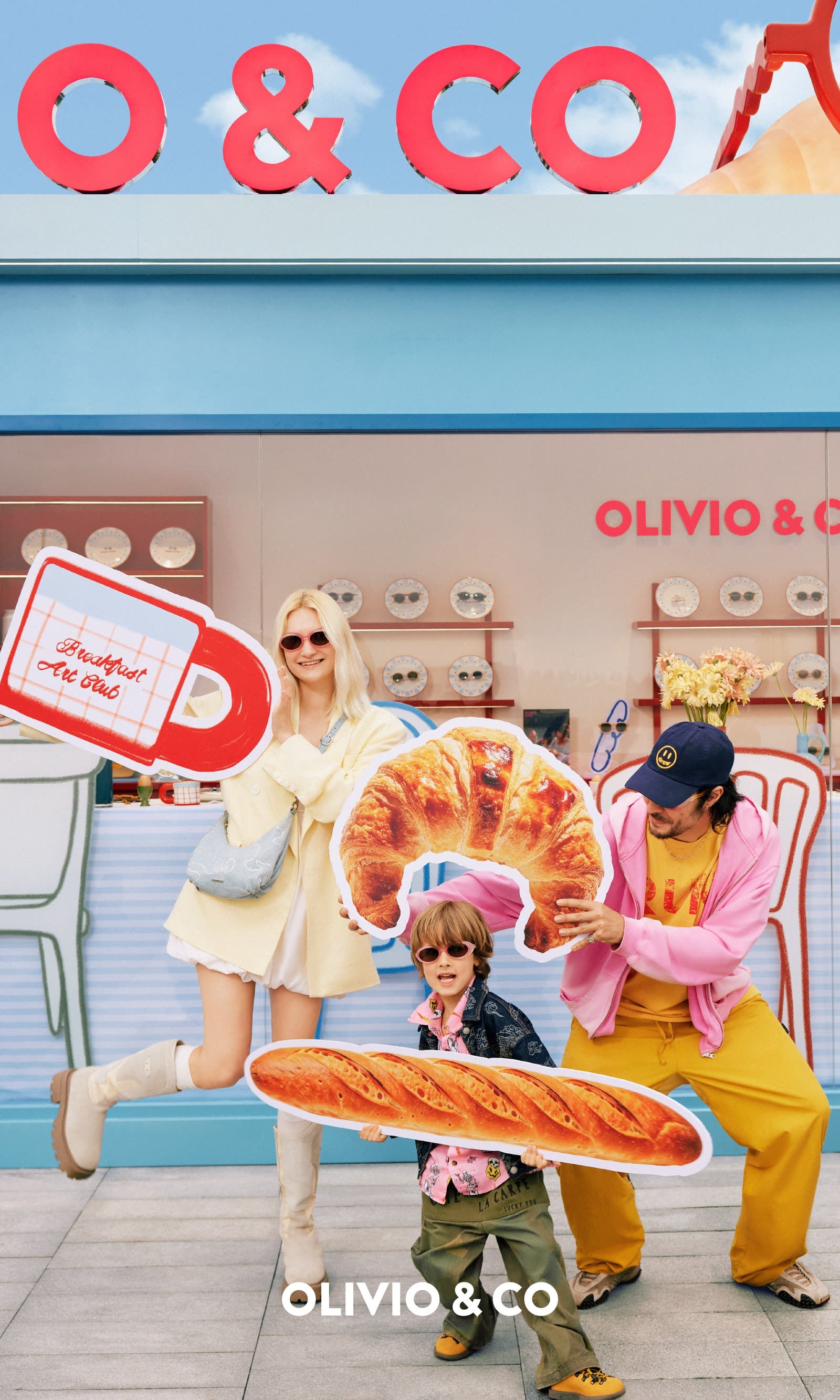 Family outdoors with kid wearing Olivio & Co sunglasses