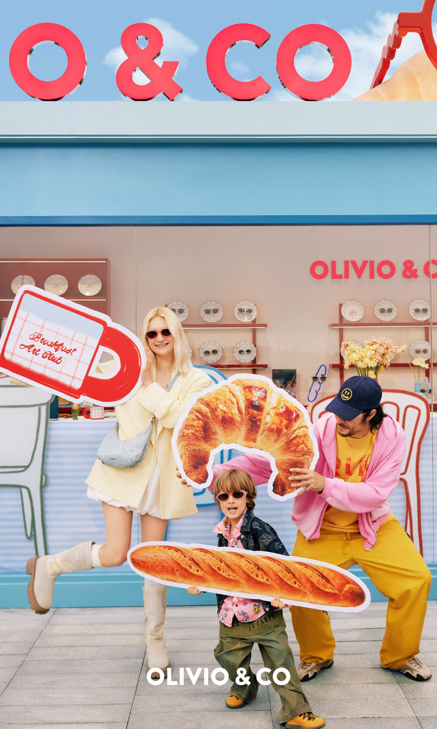 Family outdoors with kid wearing Olivio & Co sunglasses
