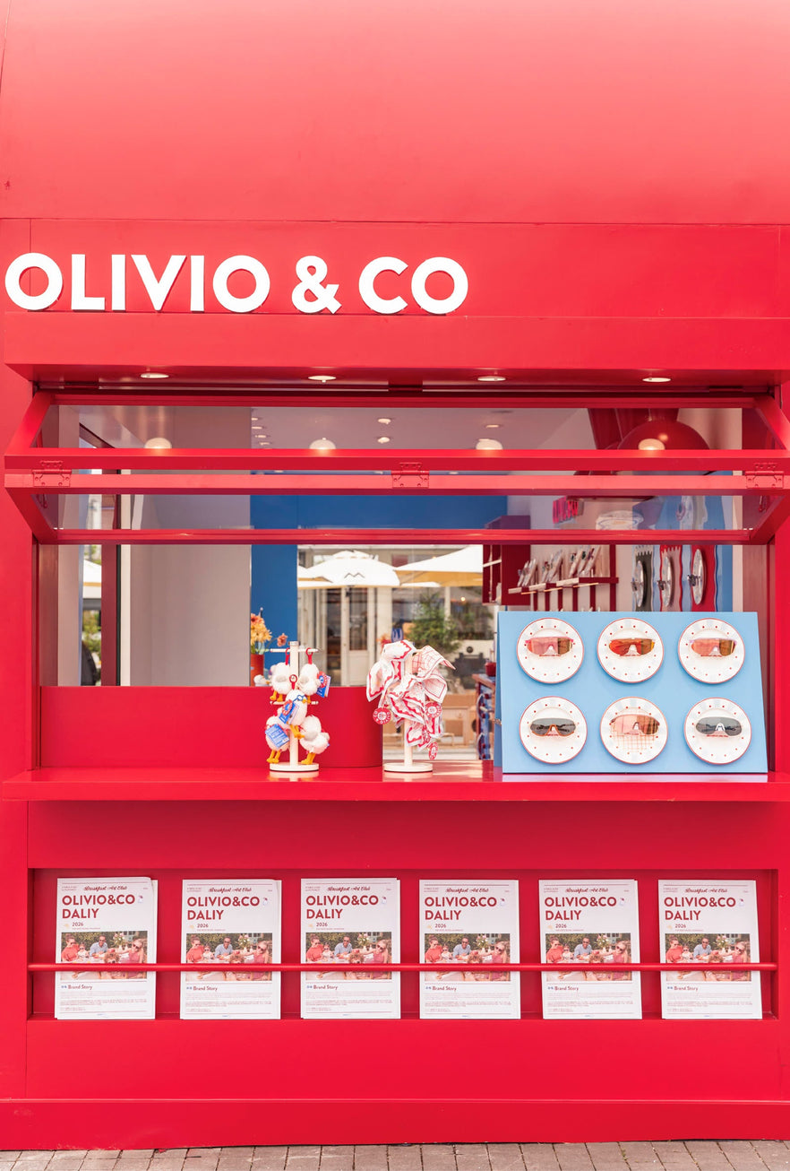 Lifestyle scene with screen and Olivio & Co eyewear
